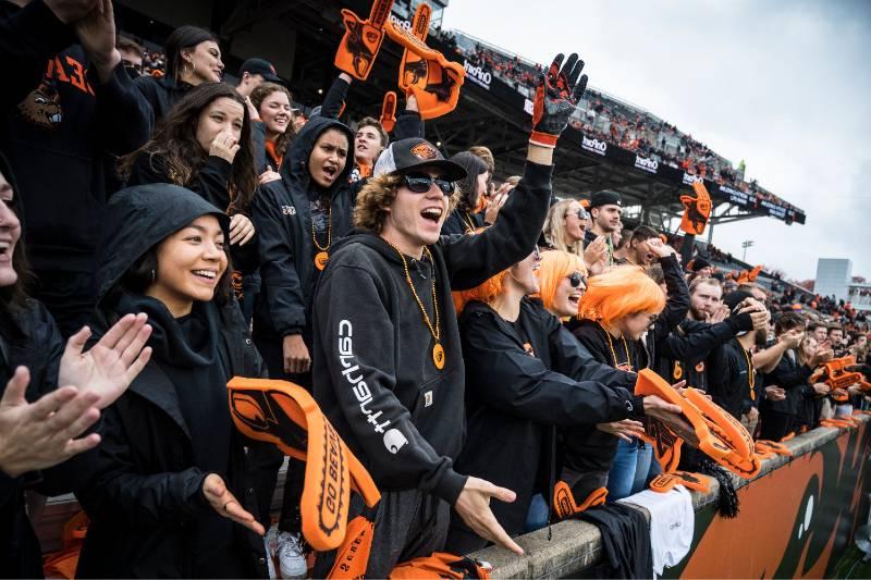 students cheering at football game